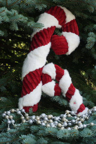 Life style of large and super-size plush candy cane dog toys.