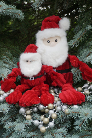 Lifestyle of small and large St. Nick Knottie plush dog toys.