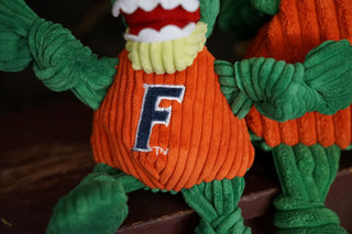 Close up image of University of Florida Gator's orange shirt with the university logo on it to show embroidery detail.
