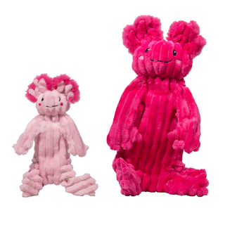 Two Axolotl small and large plush dog toys. The small one has magenta fur and the small one has light pink fur with magenta highlights. 