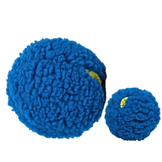 Set of two blue treat-trapper balls, one large and one small. Both are fluffy on the outside and feature three holes each to stuff and hide treats, providing a fun surprise for your dog.