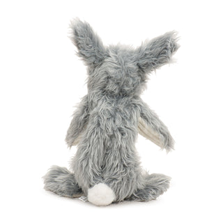 Back view of bunny plush dog toy with light gray faux-fur and white pouf ball tail..