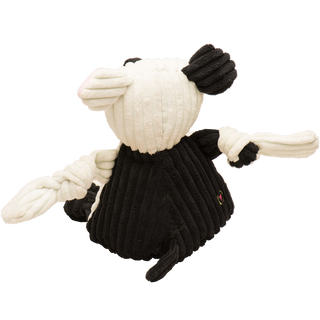 Back view of Jonny Justice durable plush corduroy dog toy: the dog has white and black fur, black and white furred right arm, black fur on the back, black furred legs, white paws, and is squeaky with knotted limbs. 