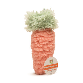 Orange HuggleFleece® carrot plush dog toy with light-green fluffy faux-fur leaves with tag.