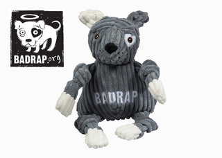 BadRap logo next to gray and white plush Knottie® dog.