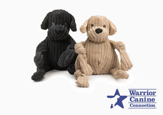 Warrior Canine Connection logo next to black and yellow lab Knotties®
