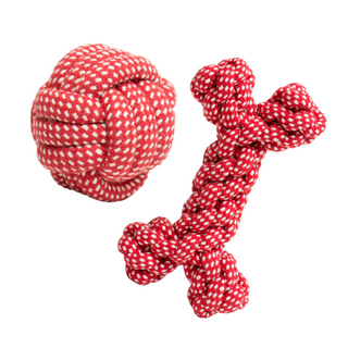 Set of two red and white knotted rope ball and bone.