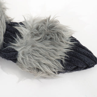 Close up of striped tail to show dark gray faux-fur texture and black corduroy fabric.