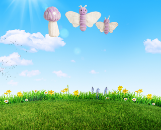 Mobile banner with blue sky, white clouds, green grass and flowers. With a set of 2 purple butterfly dog toys with white wings and a purple and white polka dot mushroom with a white stem.