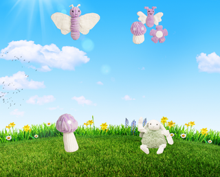 Mobile banner with blue sky, white clouds, green grass and flowers. With a set of 2 purple butterfly dog toys with white wings and a purple and white polka dot mushroom with a white stem. A flower shaped plush and crinkly dog toy with the colors purple and white, and also a white furred rabbit, with a green fluffy mid-section. 