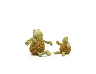 Two green knotted frogs on a white background