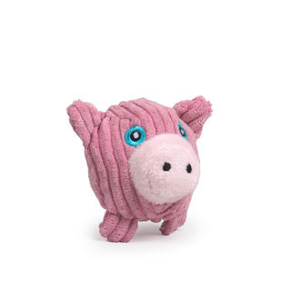 Side view of tiny pink pig plush corduroy ball dog toy with light blue eyes, and a light pink nose.