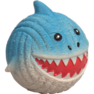 Squeaky ball shaped shark dog toy taken from the left: with blue skin, black eyes, white pupils, black nose, red mouth, white teeth, and a white stomach.