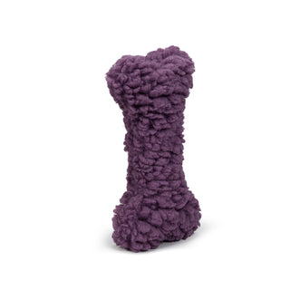 Close up image of the furry purple dog bone.