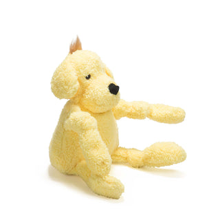 Left view of dog shaped plush dog toy: has golden yellow fur, brown hair, brown eyes, white pupils, black nose, and has knotted limbs.