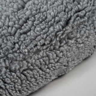 Close up view of the lambswool used on charcoal colored dog bed. 