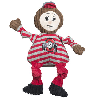 Ohio State University, Brutus the Buckeye plush dog toy: has red and gray hat, brown head, light-beige face, gray and red striped shirt, brown hands, has the university logo in red on the shirt, red pants,  black shoes, and knotted limbs. 