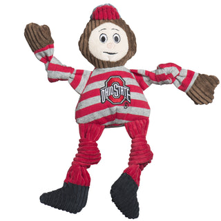 Ohio State University, Brutus the Buckeye plush dog toy: has red and gray hat, brown head, light-beige face, gray and white striped shirt, brown hands, has the university logo in red on the shirt, red pants, black shoes, and knotted limbs.