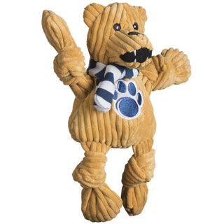 Left view of Penn State University, Nittany Lion, plush dog toy: has golden brown fur, blue and white striped scarf, university logo across the chest, and has knotted limbs.