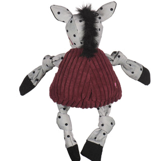 Back of Florida State University Cimarron durable plush dog toy: has white fur with black polkadots, black hair, and is squeaky with knotted limbs.