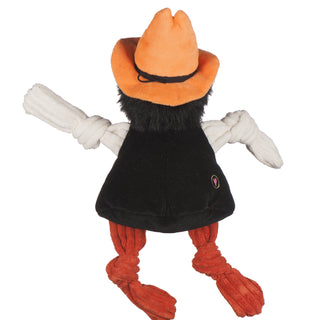 Back of Oklahoma State University Pistol Pete plush dog toy: has orange cowboy hat, black hair, light-beige skin, black vest, white sweatshirt, orange pants with university logo in black, and knotted limbs.