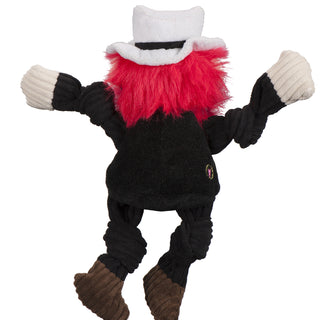 Back view of Texas Tech University Raider Red mascot durable plush dog toy with off-white hands and ears, shaggy red hair and beard, white top hat, brown shoes, and black corduroy knotted arms, legs, and shirt.