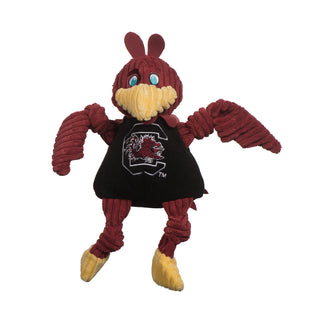 University of South Carolina, Cocky mascot durable plush corduroy dog toy with burgundy head, burgundy knotted wings and legs, blue eyes, yellow beak and feet, black shirt with university logo across the chest. Large size.