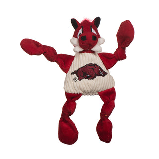 University of Arkansas Tusk the Razorback red boar mascot durable plush corduroy dog toy with knotted limbs wearing white shirt and University of Arkansas logo on the front. Size small.