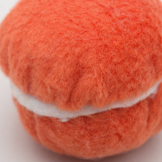 Close up of orange ma-cat-a-roonie cat toy to show fabric texture.