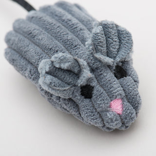 Close up of gray mightie mouse cat toy to show detail in embroidered face and corduroy fabric.