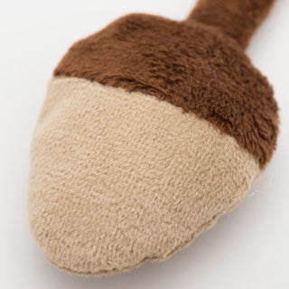 Close up image of catnip stuffed acorn shaped cat toy to show fabric texture.
