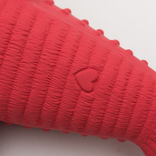 Close up image of lobster shaped durable plush dog toy back: which has the HuggleHeart logo in red. 