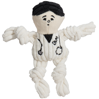 Tiny plush corduroy veterinarian dog toy with knotted limbs, white body embroidered with stethoscope around neck, and black hair.