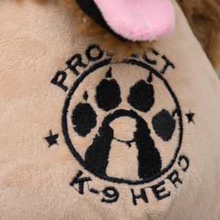 Close up of embroidered Project K-9 logo in black.