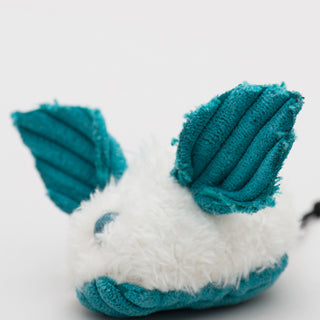 Close up of teal blue dust bunny to show detail of corduroy ears