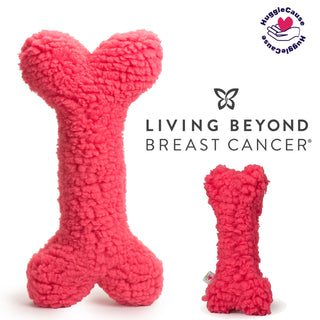 Set of two pink fluffy HuggleFleece® plush bone dog toys with squeakers. HuggleCause™ logo in the top right corner and Living Beyond Brest Cancer logo below that.