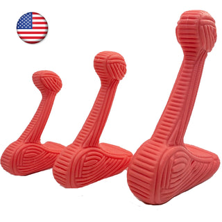 Set of three pink dog bone chew toys: each toy is in the shape of an "L", with textured ridges all throughout the toy resembling corduroy texture. 