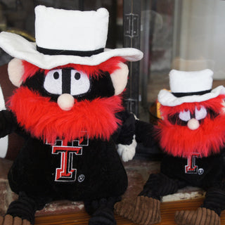 Set of two Texas Tech University Raider Red mascot durable plush dog toys in large and small sitting next to each other.