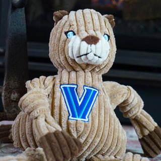 Top half of Villanova University Will D. Cat tan mountain lion durable plush corduroy dog toy with knotted limbs, brown hands and feet, blue eyes, and University logo on front. Size large.