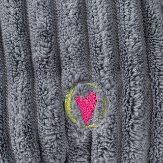 Close up view of embroidered HuggleHeart logo.